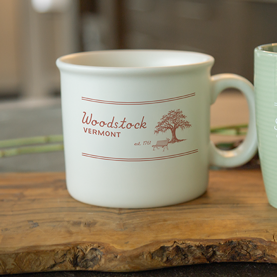 ceramic chunky mug on wooden surface with blurred background