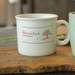 ceramic chunky mug on wooden surface with blurred background